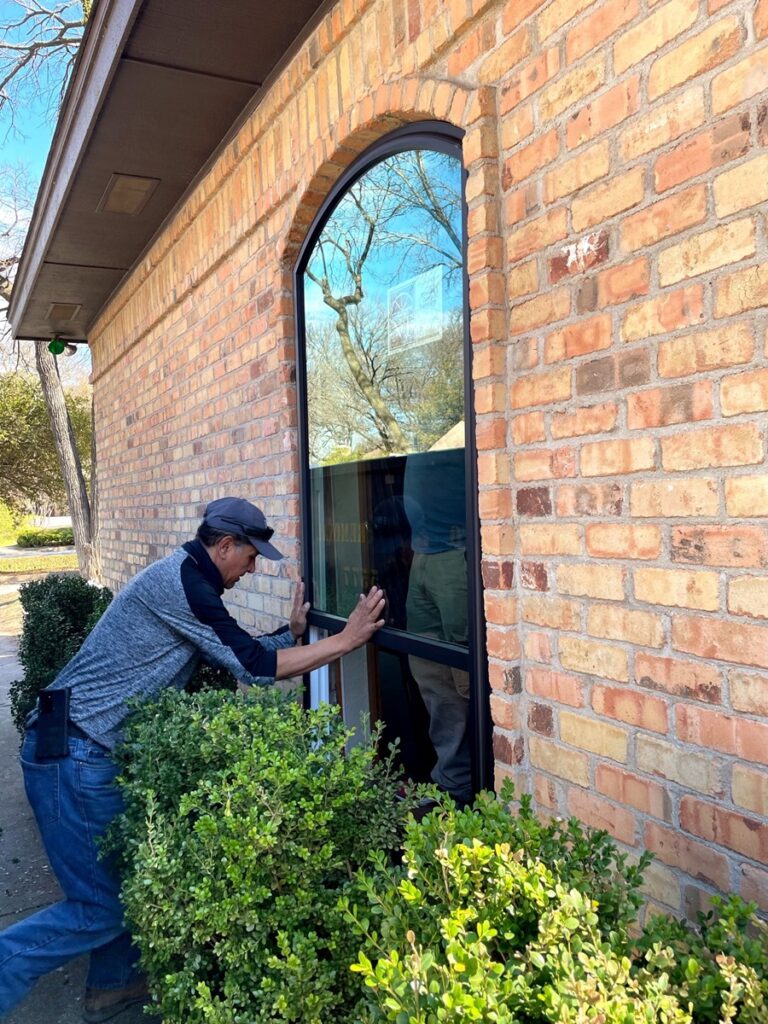 A-man-installing-replacement-window-in-St-George-UT